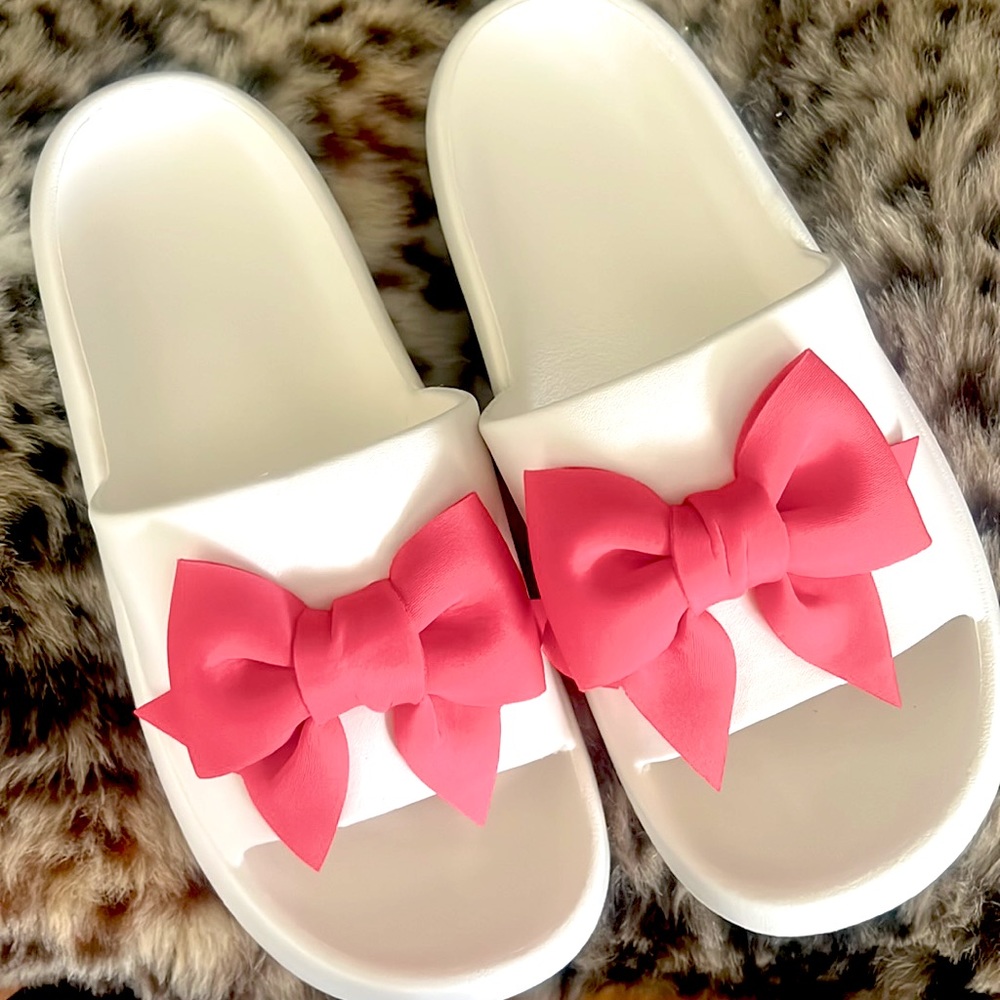 White slides with pink bows